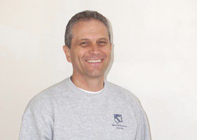 A Man in a Grey Color Shirt With a Logo