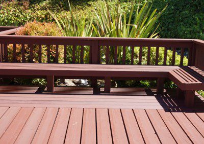 Restored deck in wood color with a lawn behind