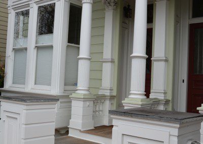 A House in White With Terracotta Stairs