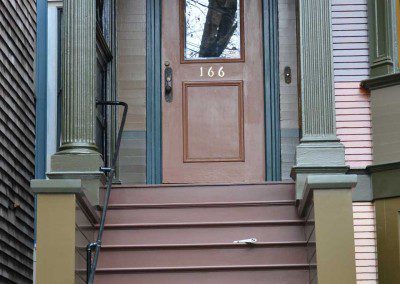 Victorian detail front door with a glass section