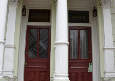 Two Detailed Front Doors in Wood Material of a House