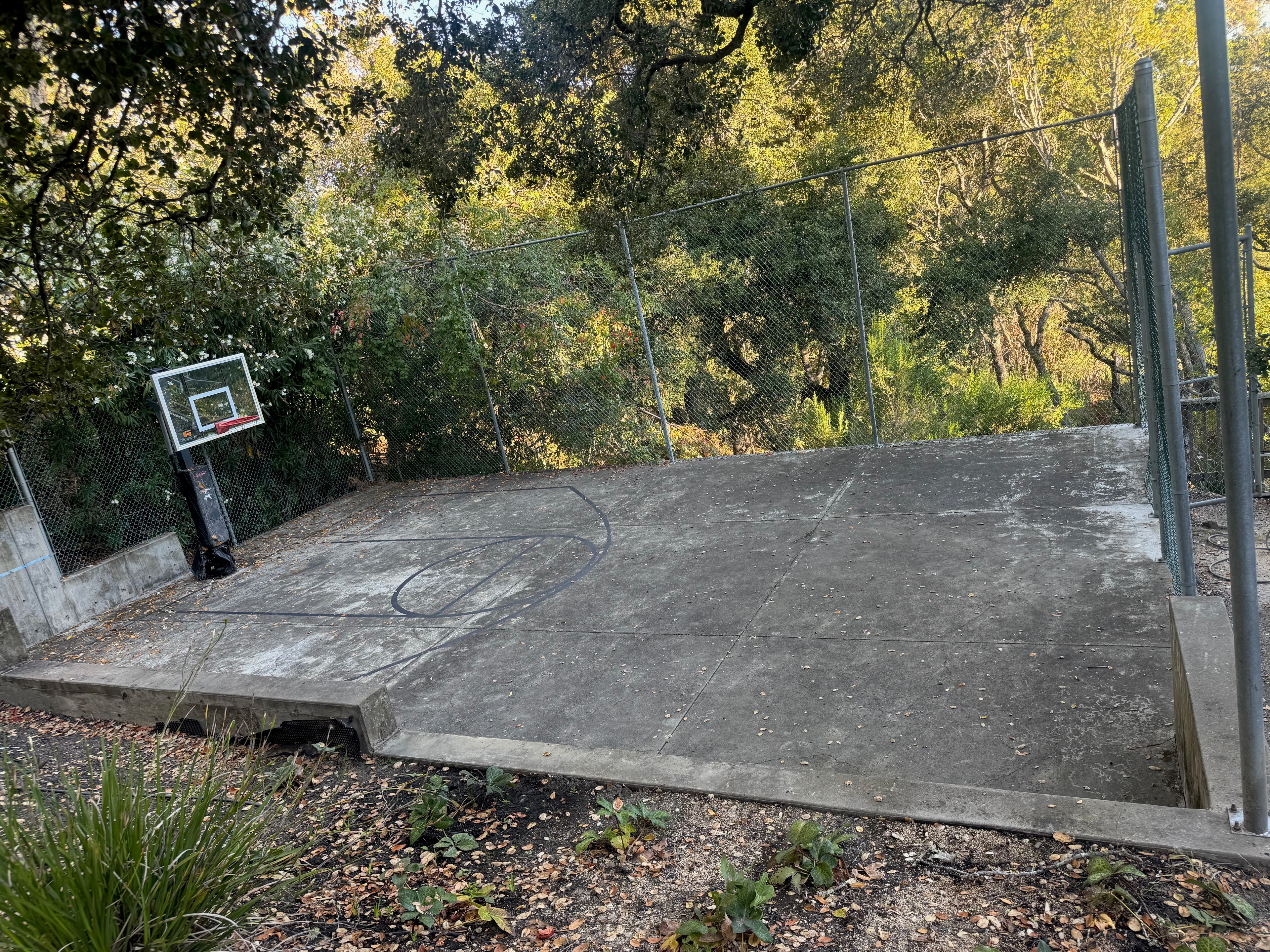 Before pressure washing at the Orinda basketball court